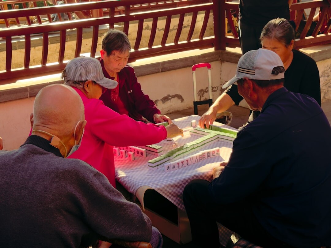 group of seniors playing cards